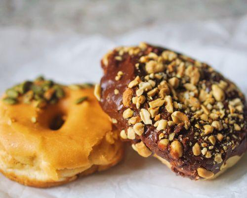 Chocolate peanut. Pumpkin frosted. Vegan doughnuts.