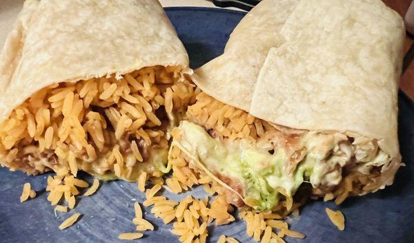 Super Chicken Burrito- chicken, rice, beans, guacamole, sour cream, and cheese.