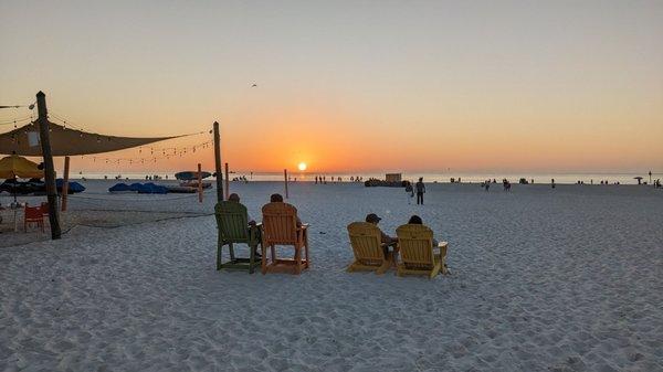 On the right is the outside seating where your feet are IN the soft sand. Awesome sunsets every time!