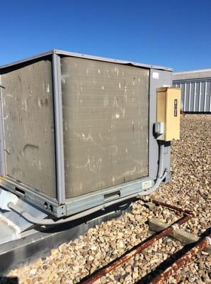 A quarterly maintenance program on a 5 ton rooftop unit. Outside coil is dirty and slight hail damage.