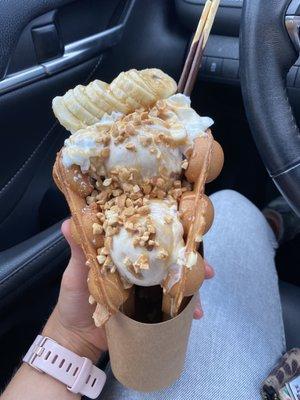 Chunky Monkey! Butter Pecan ice cream, topped with caramel, peanuts, banana and chocolate pocky on a cake-like waffle cone!