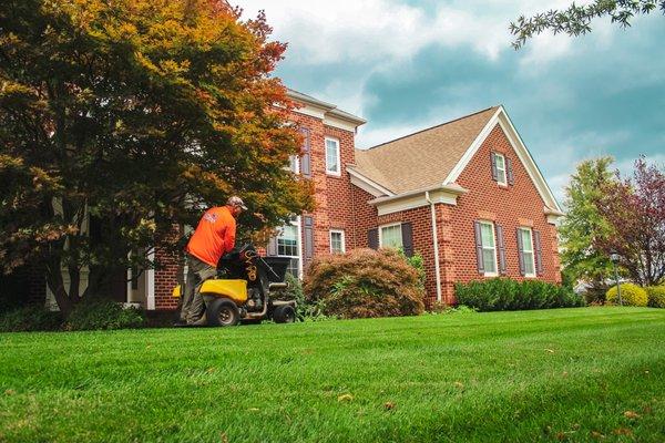 Bull Run Turf member aerating a client's lawn.