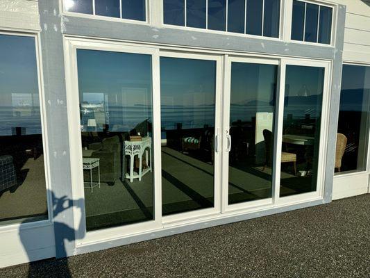 Huge 4 panel Pella patio door installation in a coastal area