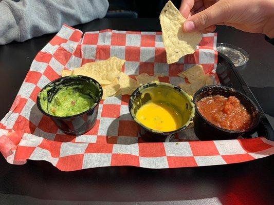 What's left of the sampler... five of us tackled it. Queso and Guac were most popular and the salsa was good too.