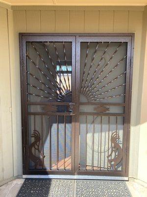 Steel Shield Security Doors--Double doors Yuma with added Kokopelli figure.