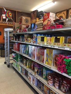 Interior of store near bakery shelves.