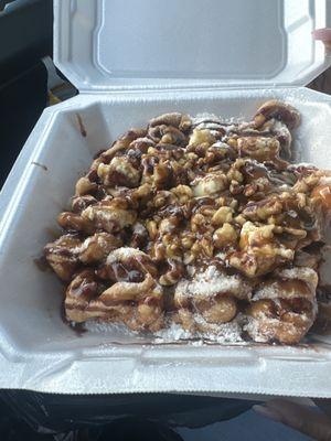 Salted caramel funnel cake with the over cream on the side.