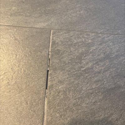 Crumbling grout all over bathroom