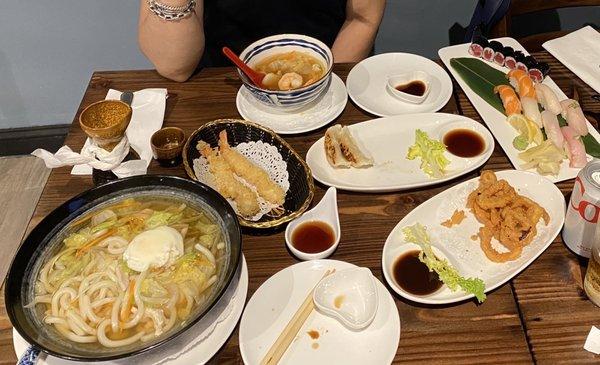 Nabeyaki Udon Soup, Hot Sake, shrimp tempura, Gyoza , Fried Calamari, and the deluxe sushi assortment.