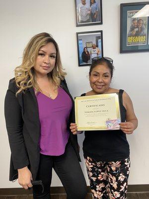 Maribel presented me with my work permit and a certificate.