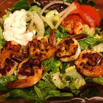 Grilled shrimp over garden salad