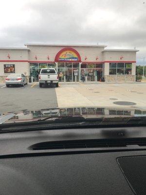 A plus Sunoco with 10 pumps and a car wash. Right next to a fast food complex.