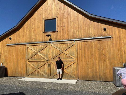 Owner Ricky standing in front of the venue location.