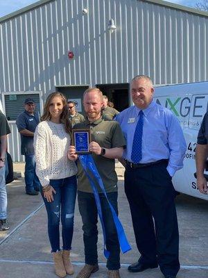 Nicolette & Xavier with NXGEN Air & Roofing at the ribbon-cutting ceremony with the Friendswood Chamber of Commerce.