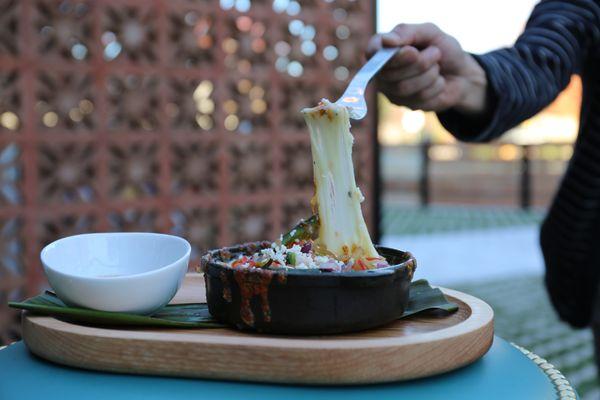 Order our Queso Fundido to start your meal.