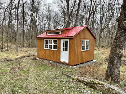 Custom shed insulated with added electrical package and finished with tongue and groove board for an office / guest space.