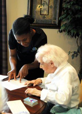 Caregiver helping a senior at home.