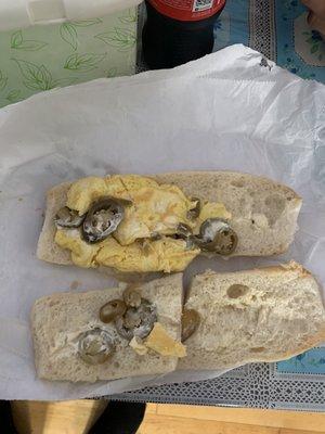 This place is a fucking joke I asked for a egg and cheese in a hero with jalapeños this  is what I got