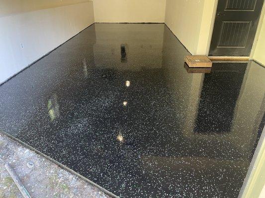 Garage-to-home gym conversion with partial broadcast epoxy floor coating