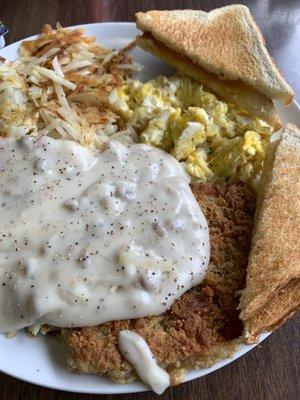 Chicken Fried Steak, 2 scrambled eggs, hash browns & toast.