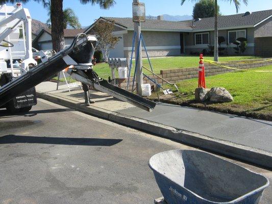 City workers pouring concrete