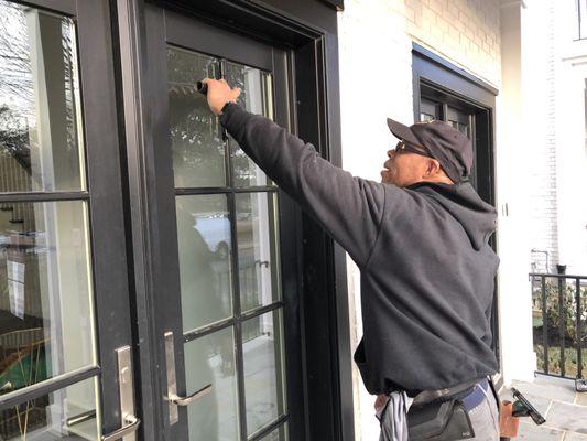 Cleaning the exterior windows on the doors!