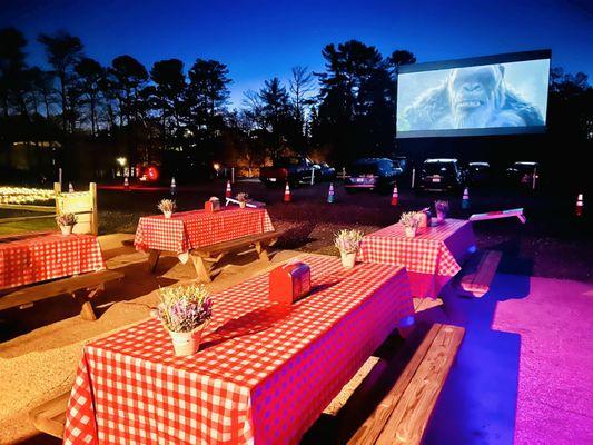 View from the Diner of the picnic tables and movie screen.