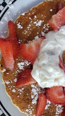 Pancake with strawberries and whipped cream