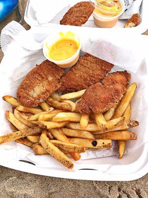 Chicken tenders with fries and a side of honey mustard