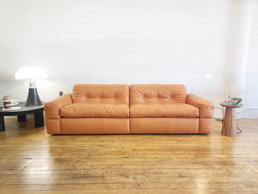 1970s Adriano Piazzesi vintage sofa newly upholstered with luxury high-grade Italian leather in a copper brown color.