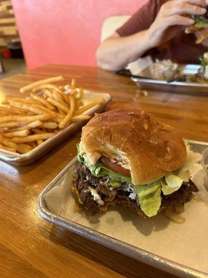 Half pound blue cheese burger with fries.