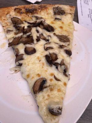 Mushroom, truffle and black garlic aioli pizza slice