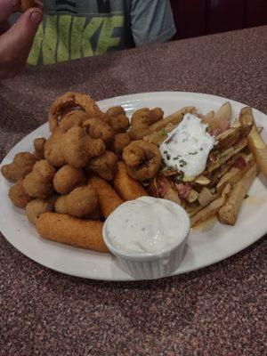 The sampler platter  Mushrooms, cheese sticks, cheese curds, onion rings , loaded fries, jalapeno poppers