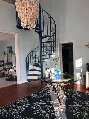 Inside of salon features a locally crafted oyster chandelier.