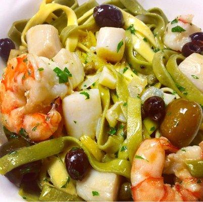 Tagliatelle pasta with shrimp, scallops and preserved lemon.