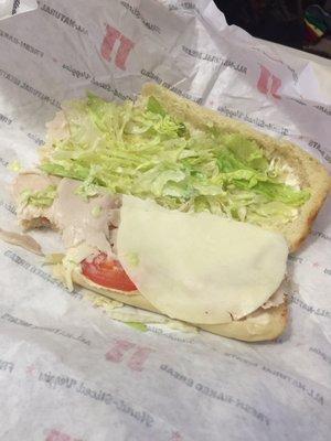 a turkey Tom.more like 2 smallpieces of turkey, a piece of provolone cheese, shit ton of lettuce but no sprouts, 2 pieces of tomato.