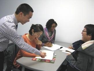 Students Working with Their Teacher