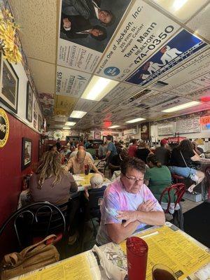 Saturday morning crowded cafe.