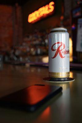 Enjoying a Rainier tall boy at the bar.