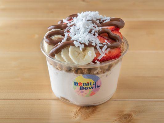 CLOUD NINE - COCONUT BASE TOPPED WITH GRANOLA, BANANA, STRAWBERRY, COCONUT FLAKES, & NUTELLA.