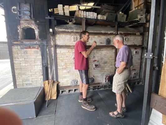 Kevin explaining to Michael the firing process