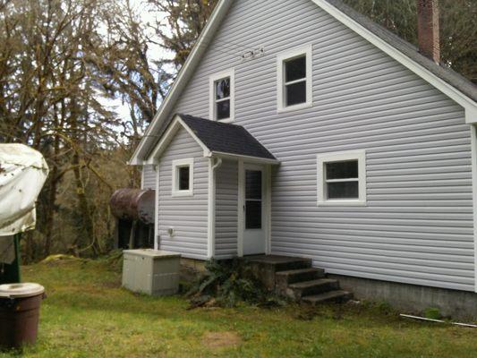 Siding after side view house #1