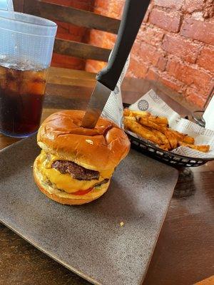 Double cheeseburger, basket of French fries, soda