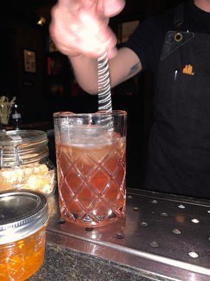 Hot bartender mixing a drink