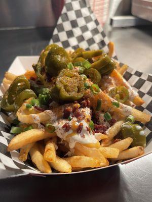 Loaded Fries- Nacho Cheese, Ranch, Hot Chick Sauce, Bacon, Jalapeños, Scallions