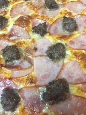 Canadian bacon and hamburger pizza