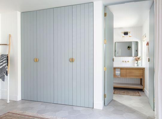 Custom closet doors and entryway doors to bathroom