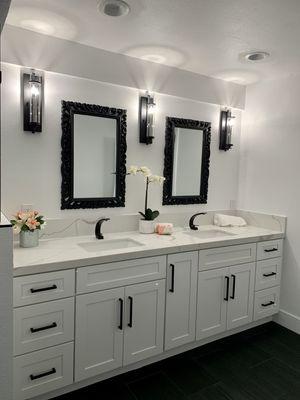 Double sink white shaker vanity with Calcutta luna countertops.