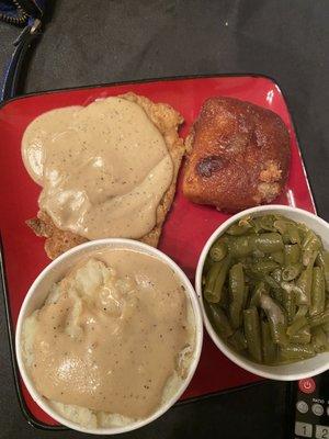 Dry ass chicken, season-less greens, bland gravy