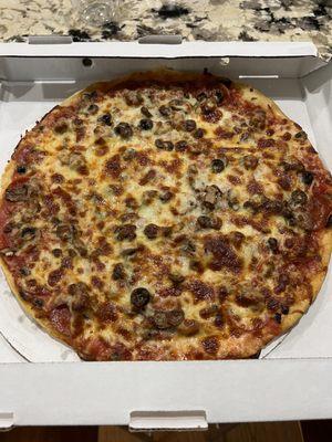 Thin Crust Pizza with sausage, pepperoni, mushrooms and black olives